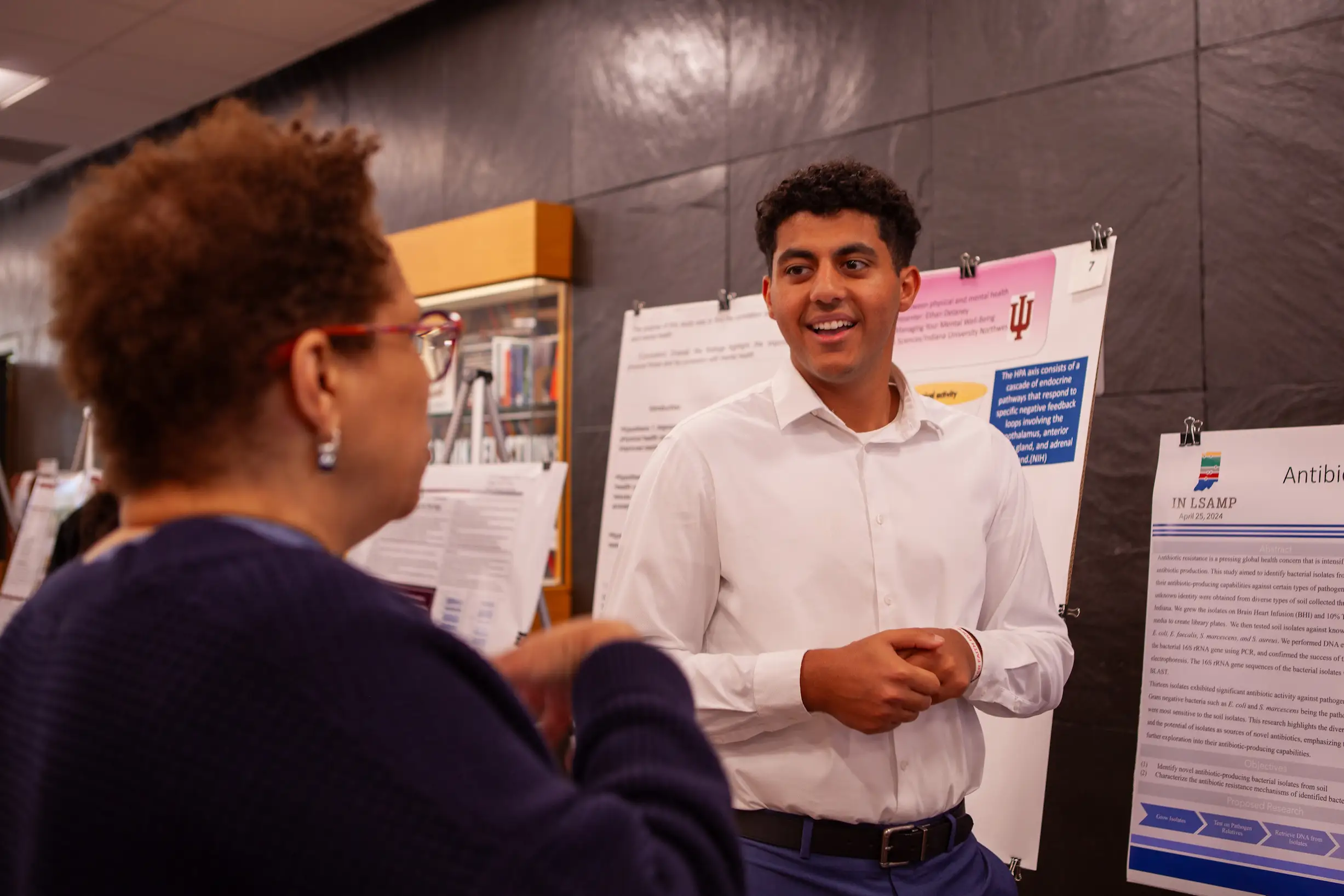 A man gives a presentation to a woman.