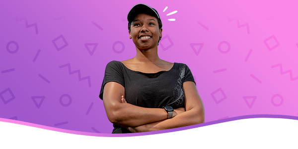 Student in front of an purple-pink gradient background