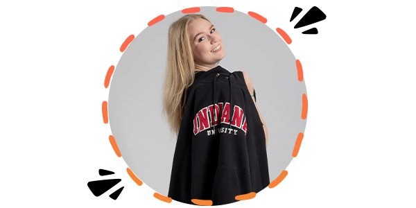 A female student with her Indiana University hoodie draped over her shoulder, in a circle frame