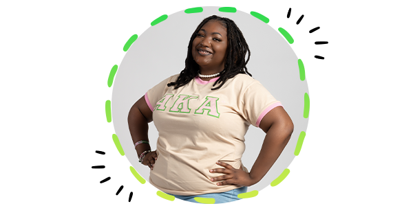 A female student in her sorority shirt in a circle frame