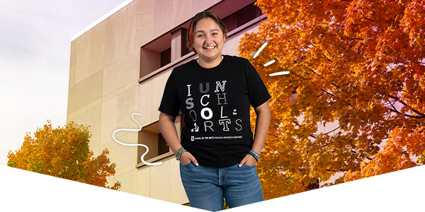 Student wearing IUN School of Arts shirt in front of a campus beauty shot
