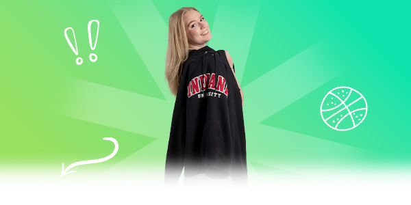 A student holding a Indiana University hoodie with doodle icons around her