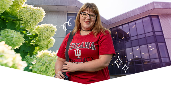 Student wearing Indiana University Northwest shirt in front of a campus beauty shot