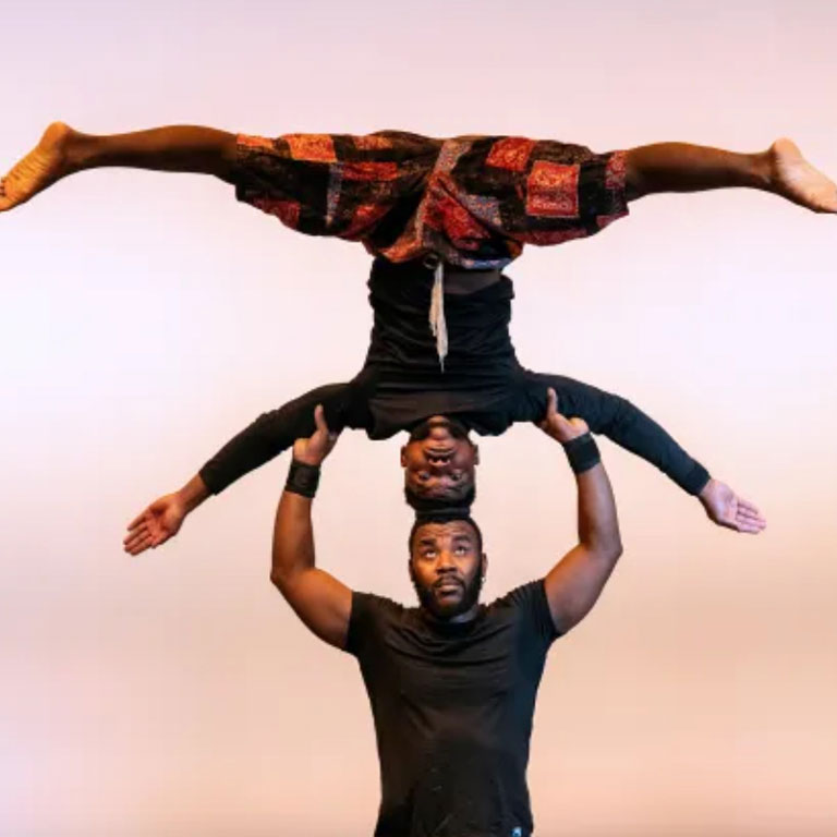 Matiga Koba, bottom, and Riziki Mikongo of The Zuzu African Acrobats from Tanzania perform at Indiana University Northwest in Gary on Thursday, Feb. 1, 2024.